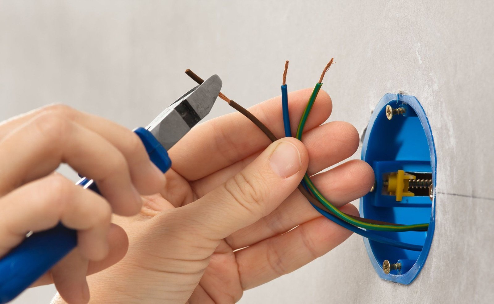 Electrician stripping wires