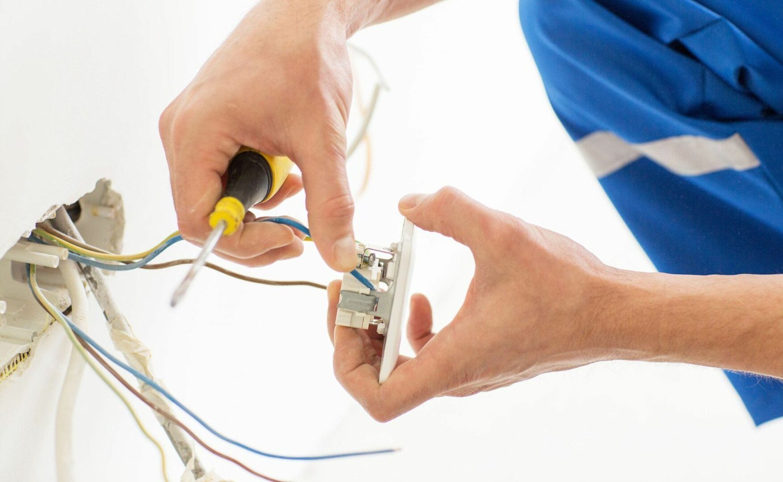 Electrician wiring a socket